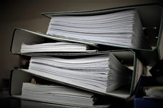 stack of legal files on a desk