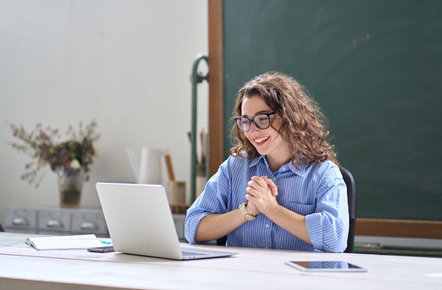 Engineering professional studying an online MEM program on a laptop